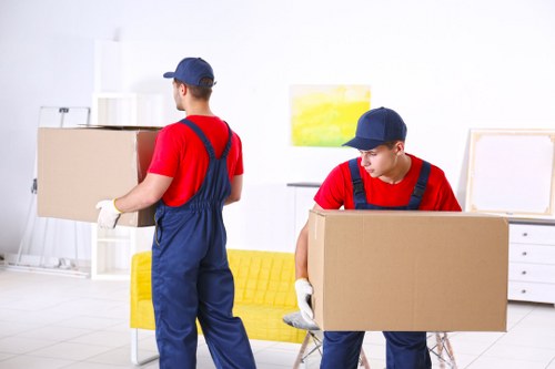 Removal van and moving crew in a Stockwell residential street