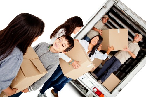 Removal crew transporting furniture for a local Stockwell apartment move