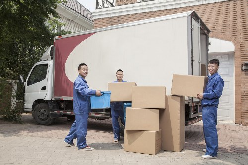 Local moving team loading items into a van near Stockwell