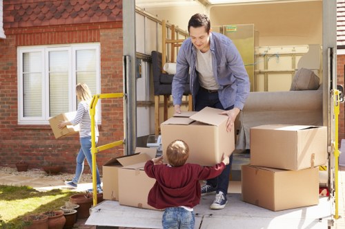 Professional movers protecting a grand piano during a local relocation