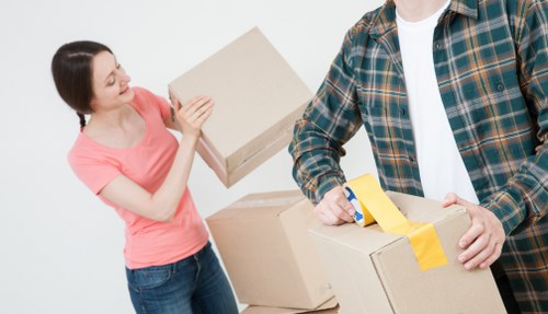 Removal team handling boxes and furniture during a Stockwell move