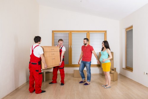 Office movers planning a relocation in Stockwell with boxes and desks prepared for transport
