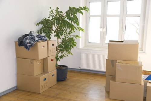 Staff wearing PPE while loading items for a move