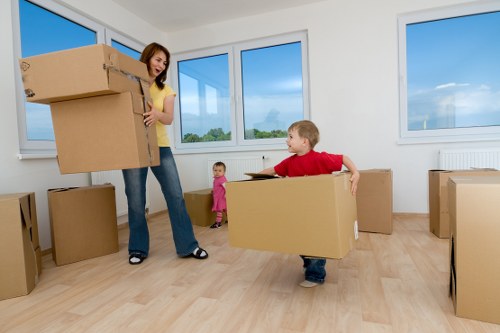 Local office relocation team handling furniture and office items near Stockwell commercial premises