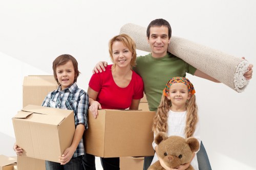 Team using safe lifting techniques during a move